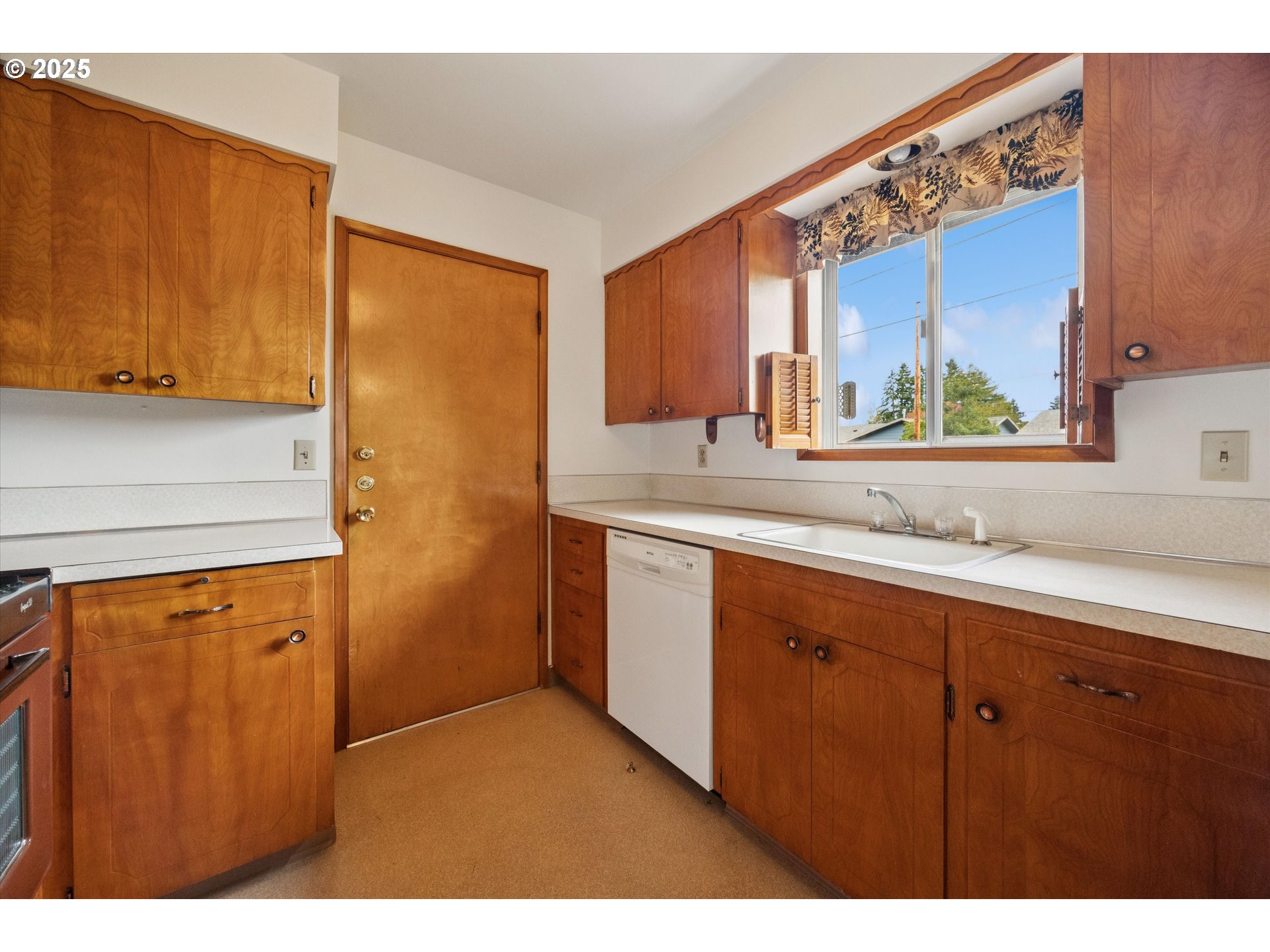 121 Southeast 166th Avenue Portland, OR 97233 - Photo 11 of 27 a bathroom with a sink a mirror and a window