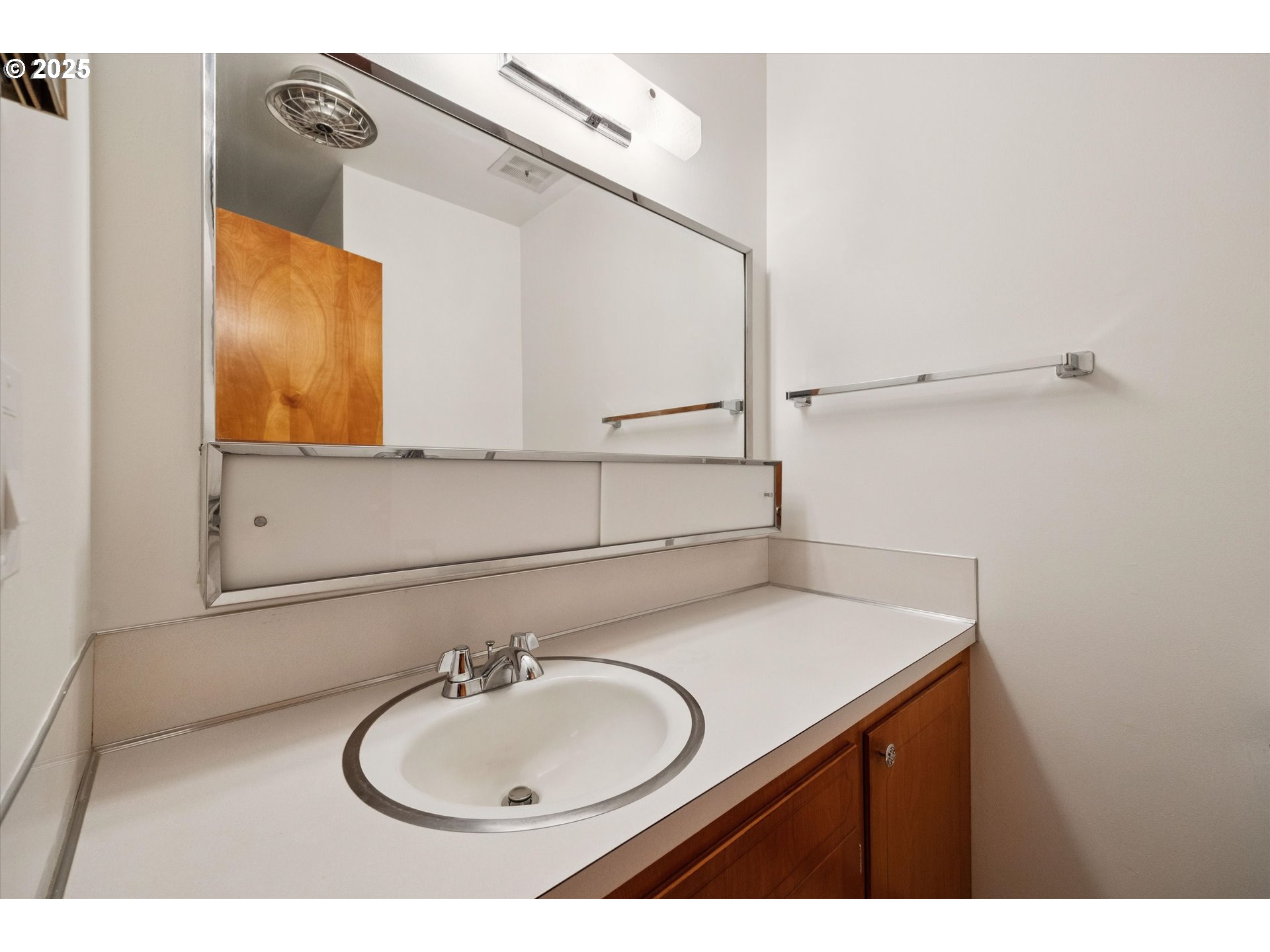 121 Southeast 166th Avenue Portland, OR 97233 - Photo 18 of 27 a bathroom with a sink and a mirror