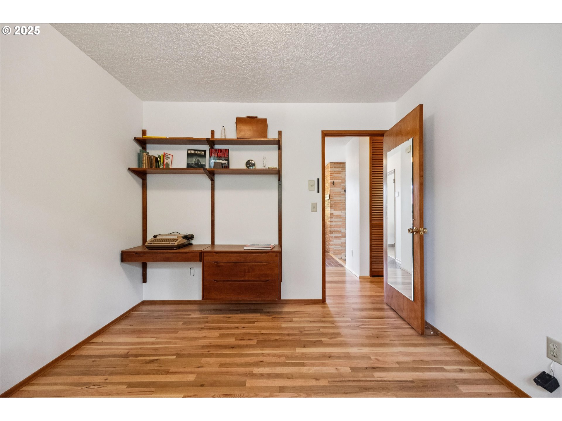121 Southeast 166th Avenue Portland, OR 97233 - Photo 21 of 27 a view of empty room with wooden floor and chair