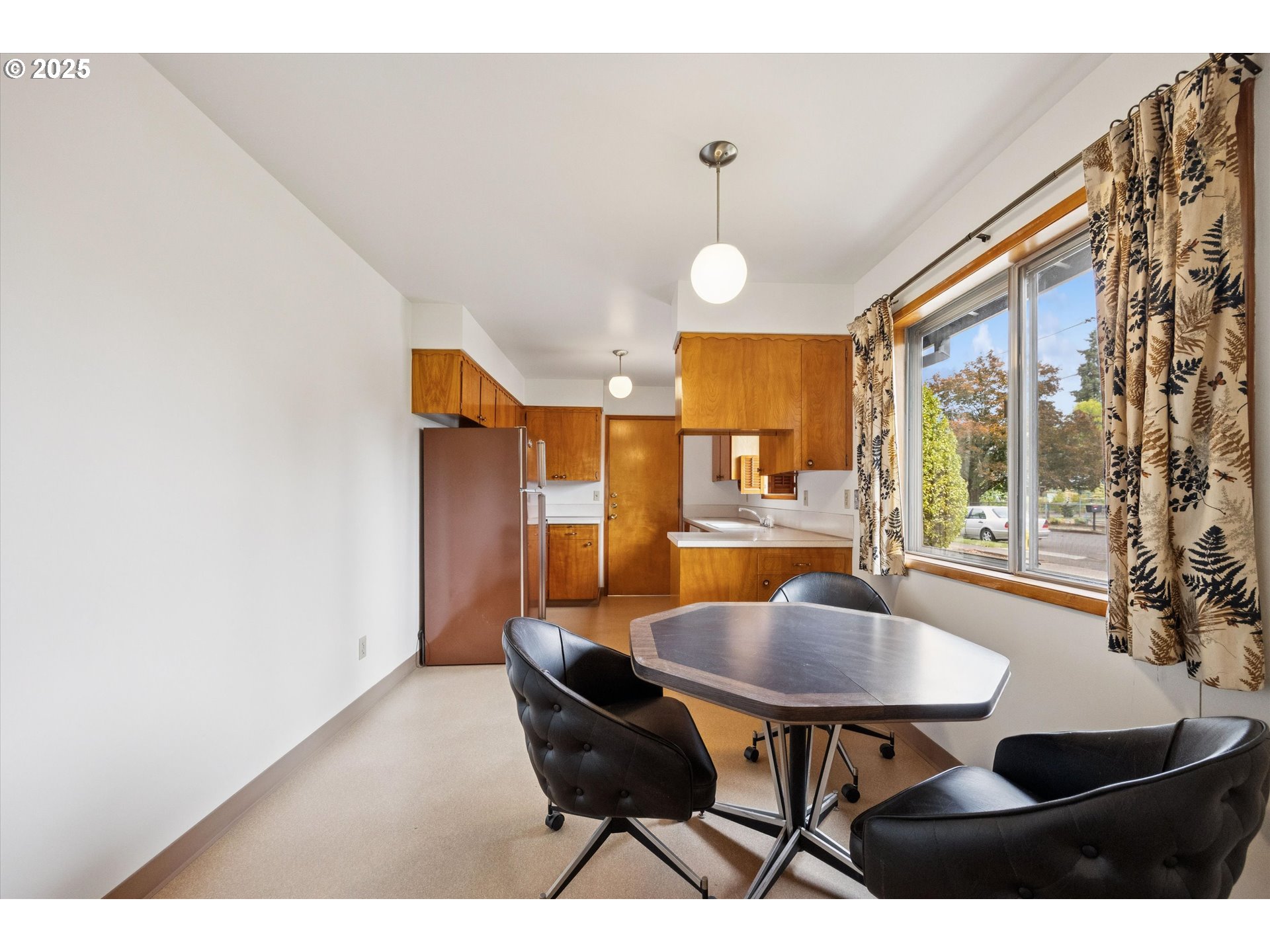 121 Southeast 166th Avenue Portland, OR 97233 - Photo 8 of 27 a view of a dining room with furniture and a large window