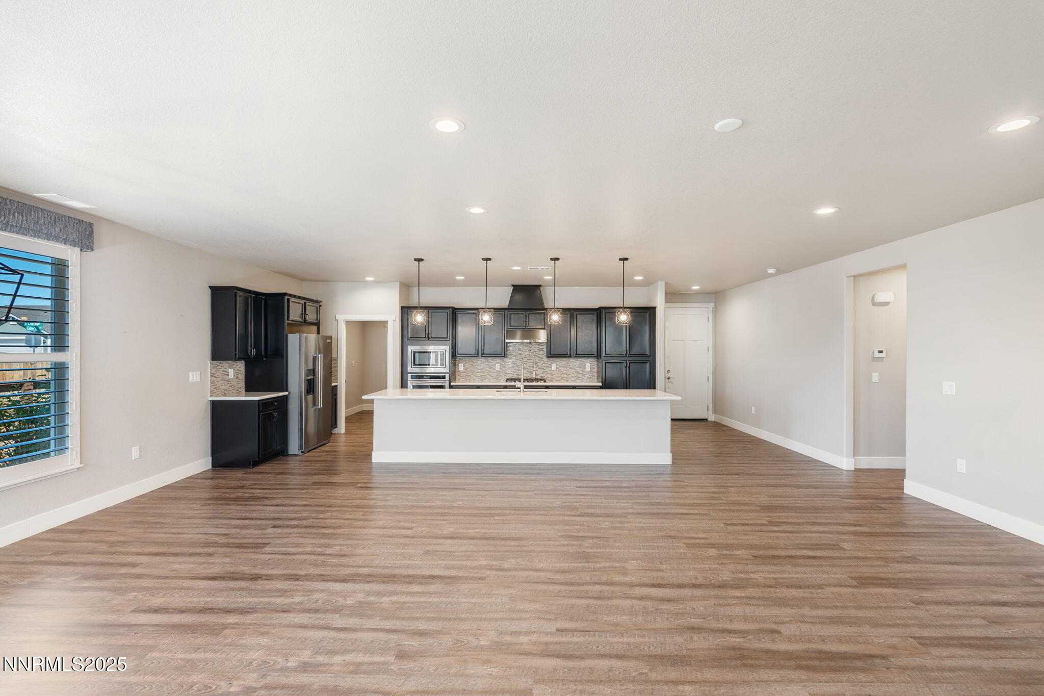 774 East Cottage Loop Gardnerville, NV 89460 - Photo 12 of 31 a view of kitchen with kitchen island granite countertop a large counter top stainless steel appliances and cabinets
