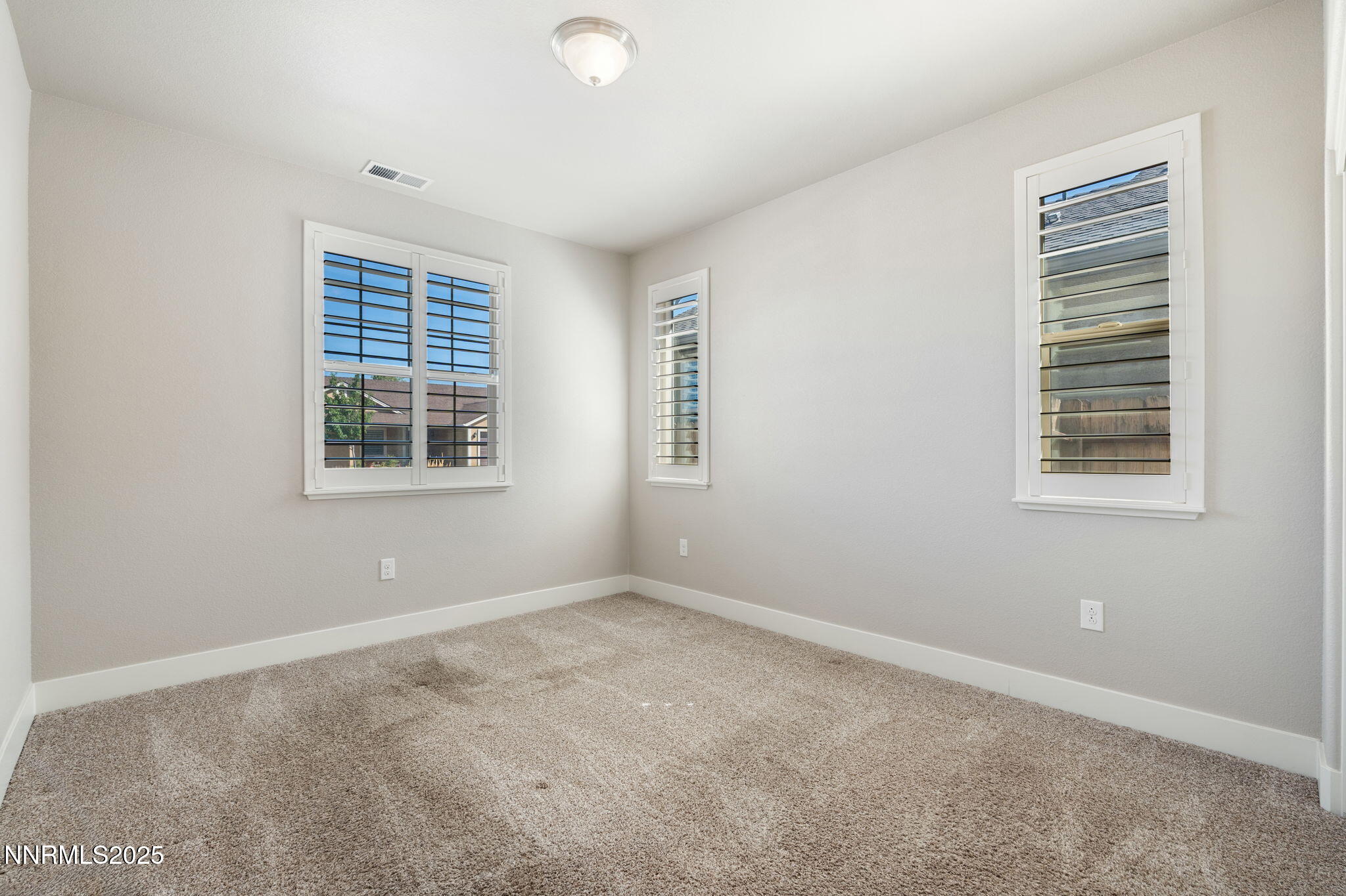 774 East Cottage Loop Gardnerville, NV 89460 - Photo 25 of 31 an empty room with windows
