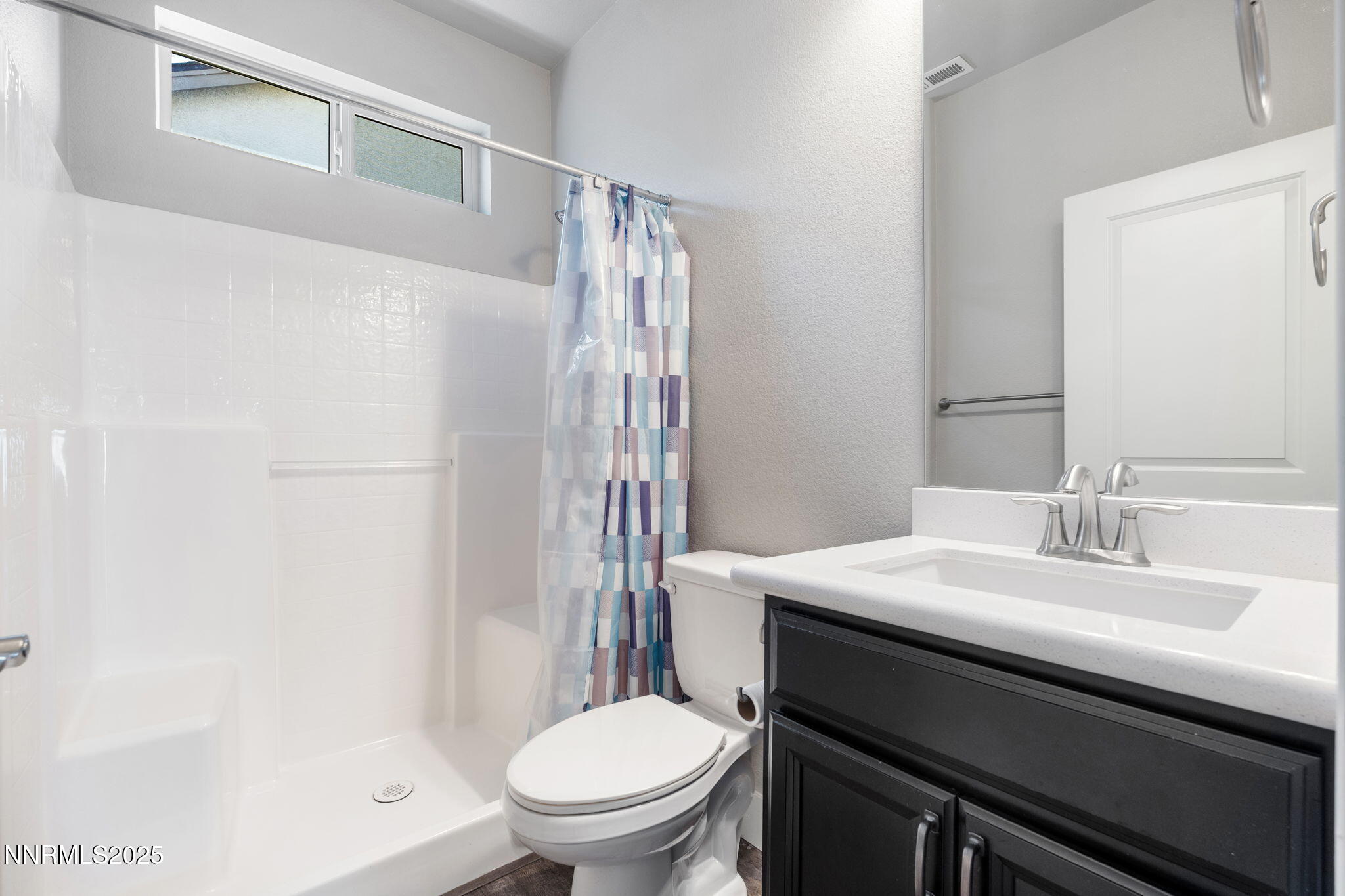 774 East Cottage Loop Gardnerville, NV 89460 - Photo 26 of 31 a bathroom with a sink toilet and shower