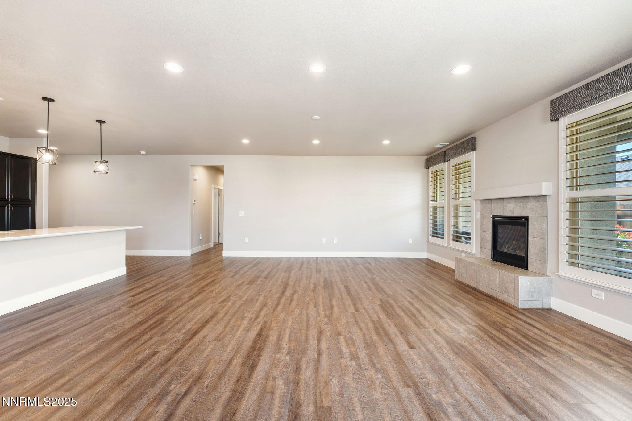 774 East Cottage Loop Gardnerville, NV 89460 - Photo 10 of 31 a view of empty room with wooden floor and fireplace