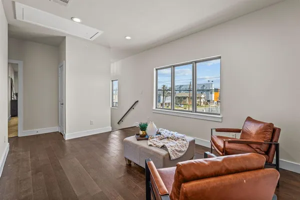 a view of a livingroom with furniture and wooden floor