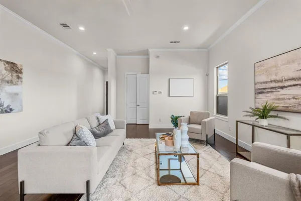 a living room with furniture and a table