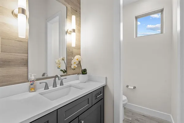 a bathroom with a sink and a mirror