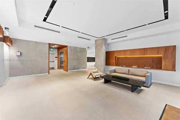 a view of a livingroom with a flat screen tv