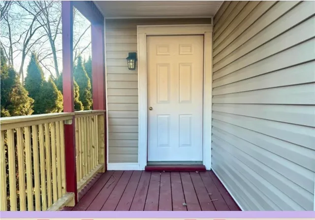 a view of balcony with wooden floor