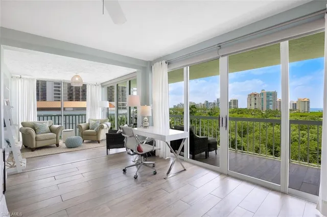 a living room with furniture and windows