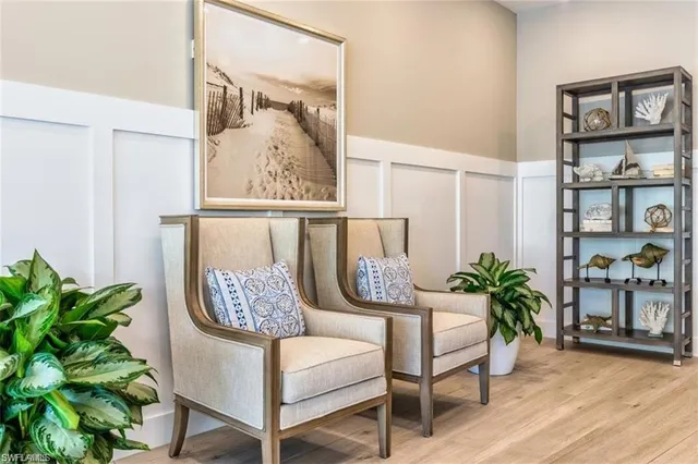 a view of a hallway with seating area