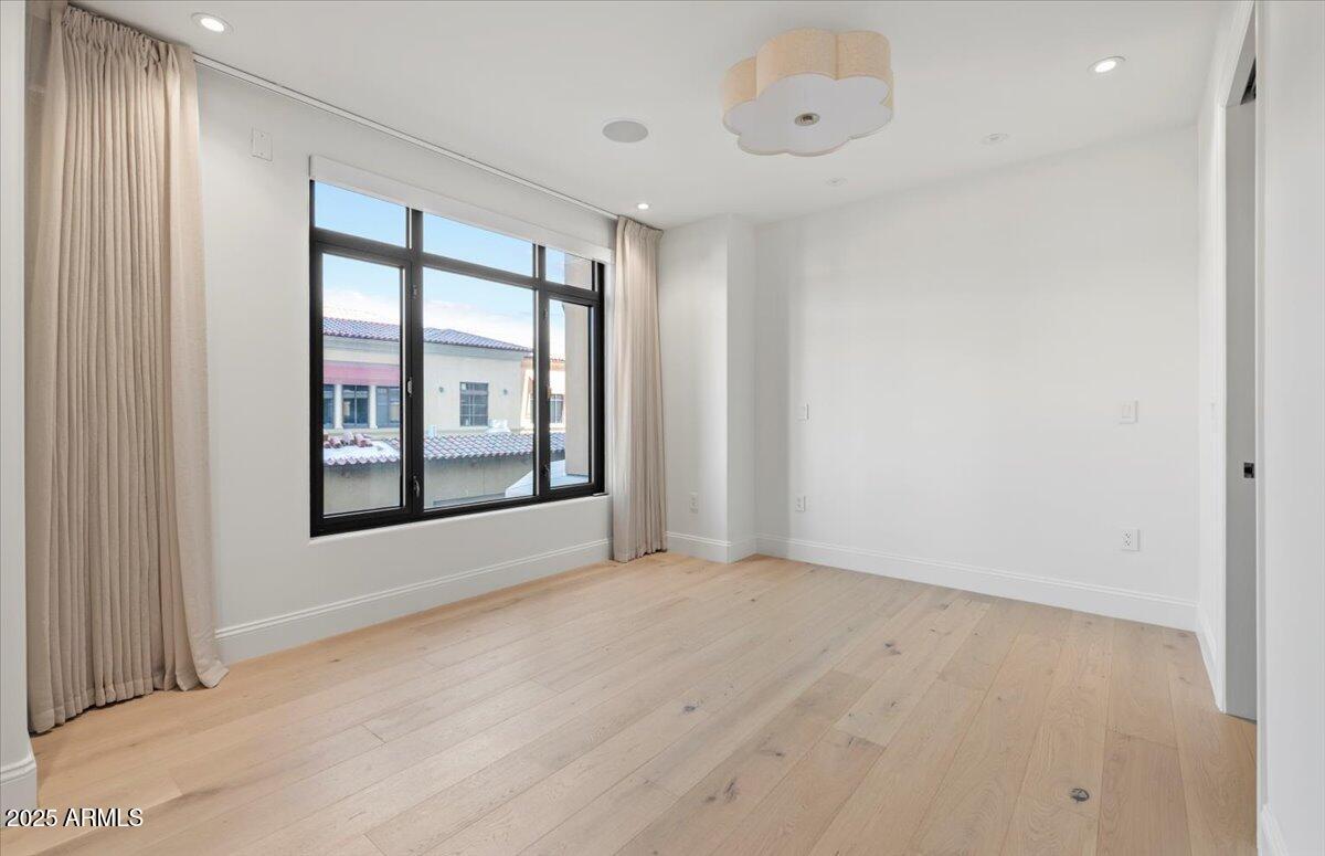 7181 East Camelback Road, Unit 301 Scottsdale, AZ 85251 - Photo 15 of 22 a view of an empty room with a window