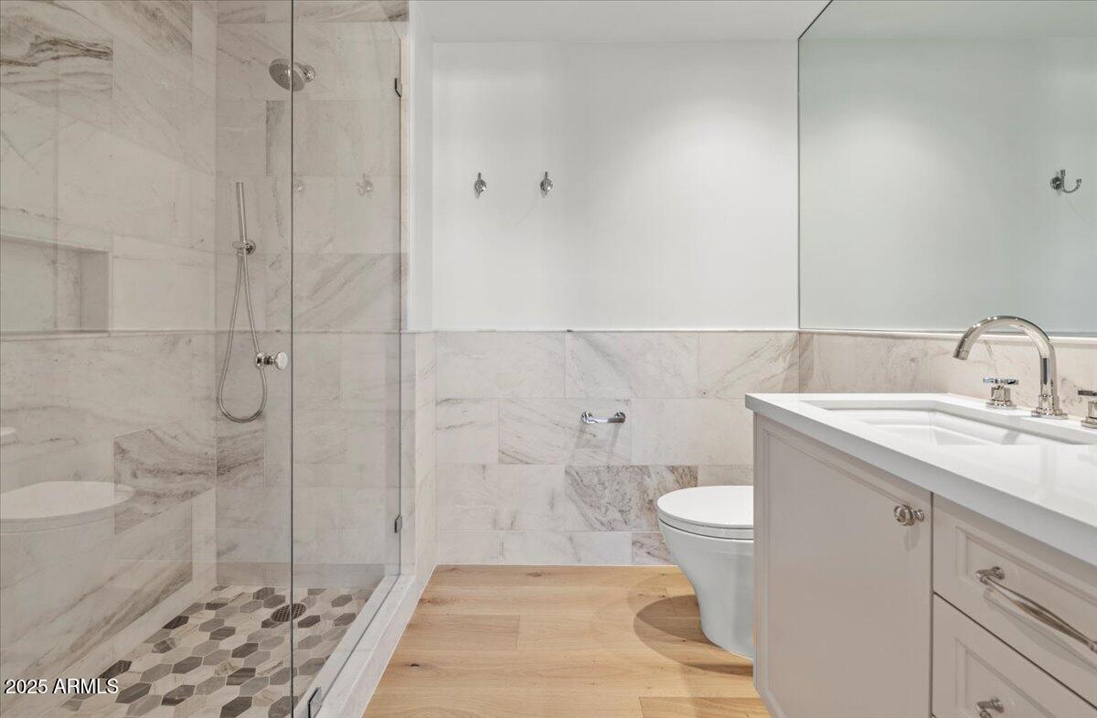 7181 East Camelback Road, Unit 301 Scottsdale, AZ 85251 - Photo 16 of 22 a bathroom with a sink toilet and shower