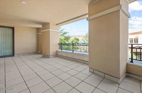 a living room with furniture and large windows