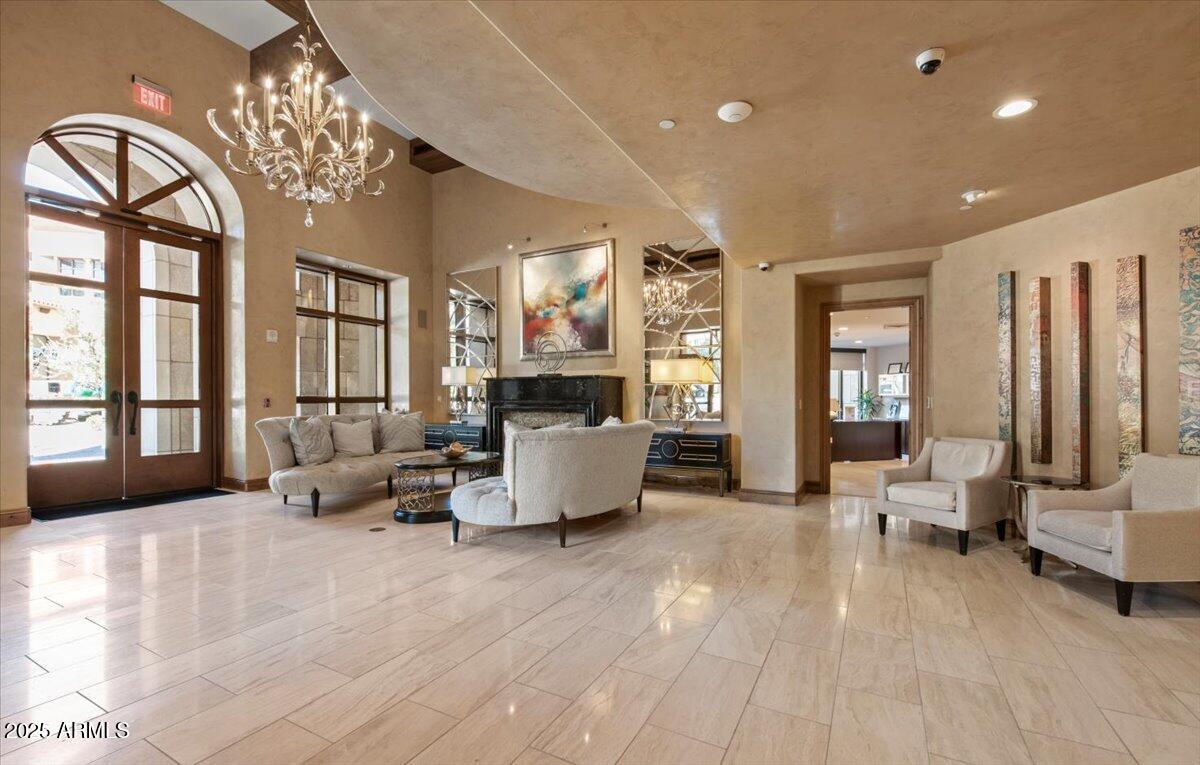 7181 East Camelback Road, Unit 301 Scottsdale, AZ 85251 - Photo 19 of 22 a living room with furniture and large windows