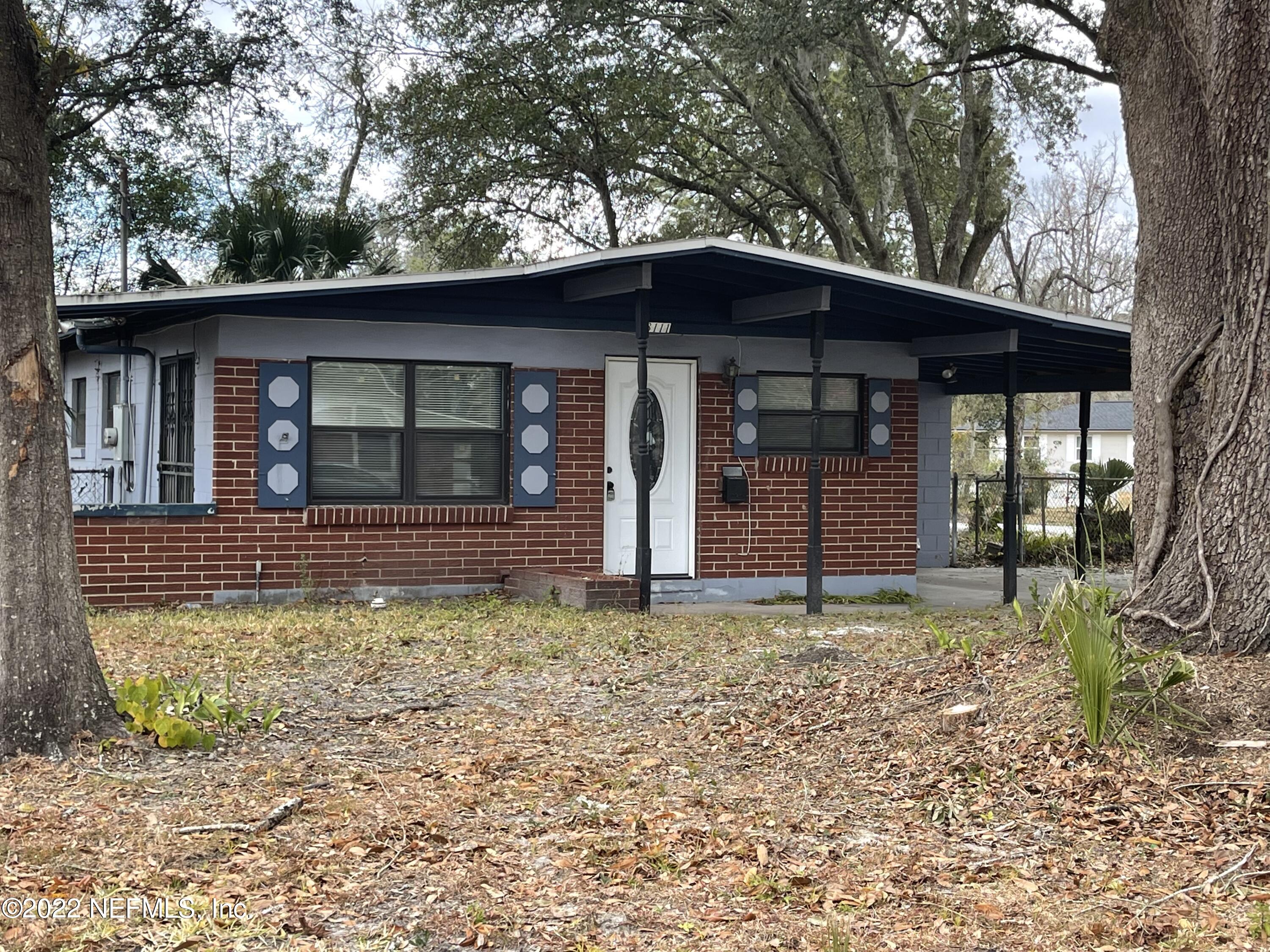3111 Ray Road Jacksonville, FL 32209 - Photo 1 of 19 a front view of a house with garden