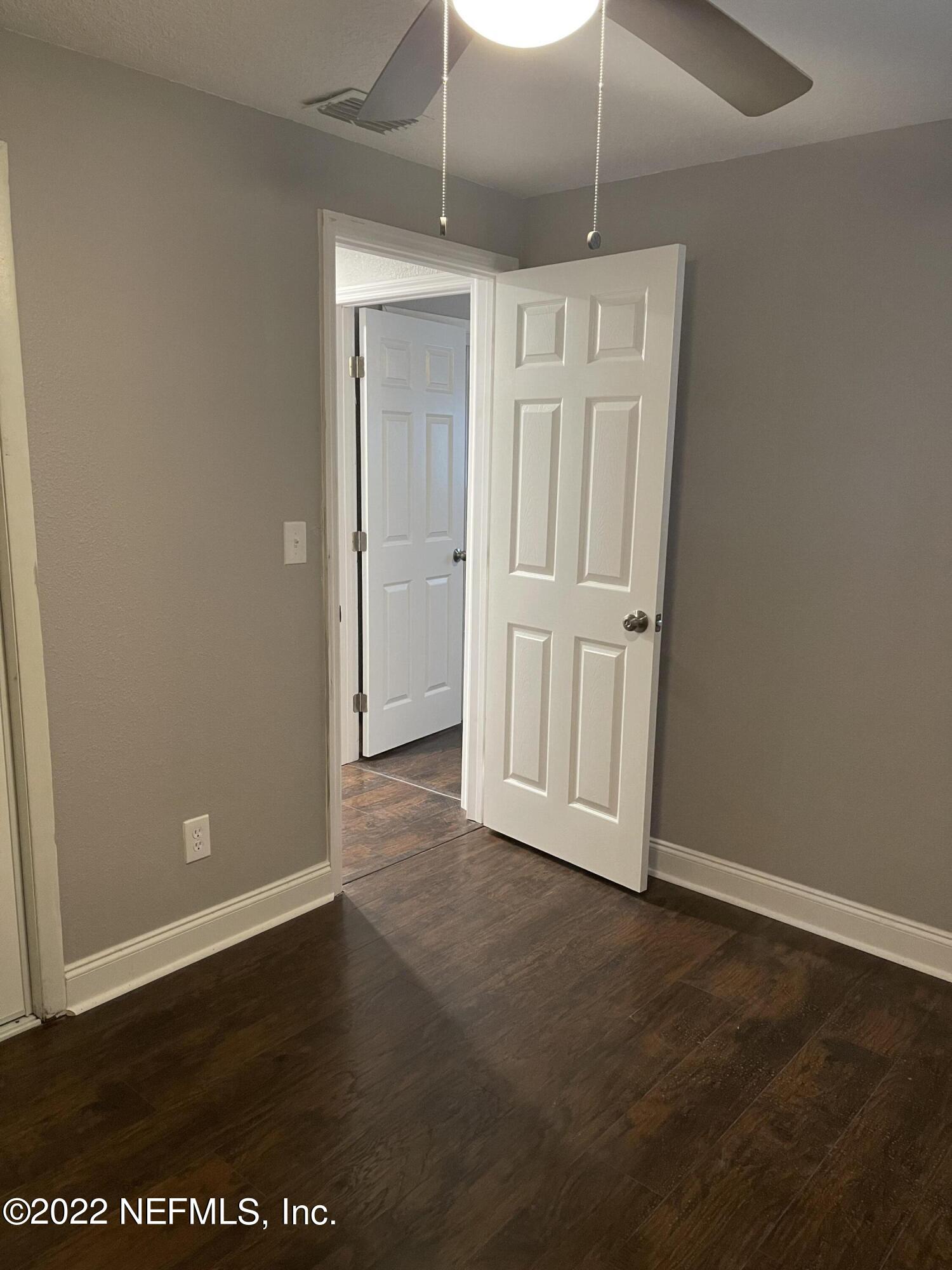 3111 Ray Road Jacksonville, FL 32209 - Photo 12 of 19 a view of empty room with wooden floor