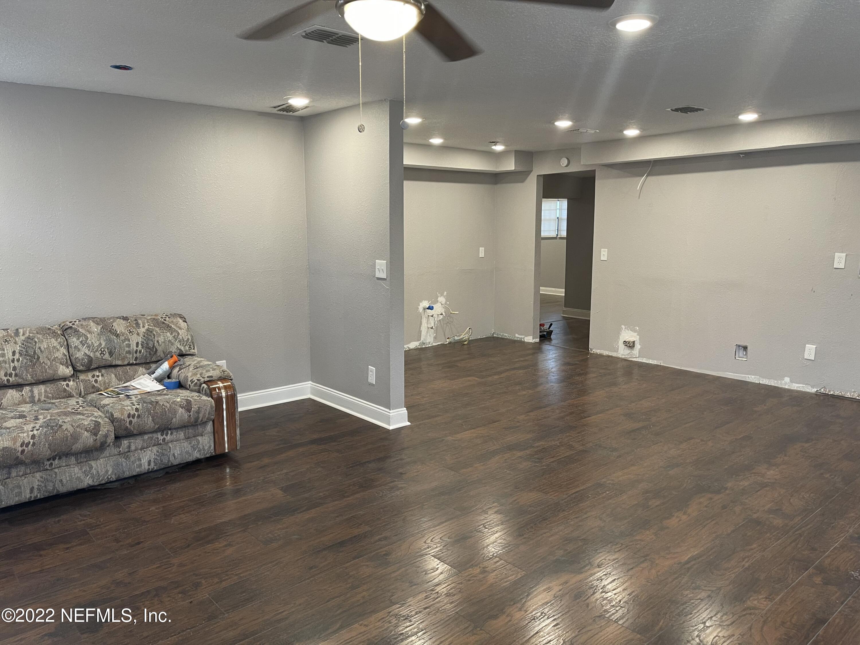 3111 Ray Road Jacksonville, FL 32209 - Photo 3 of 19 a view of livingroom with furniture wooden floor and chandelier