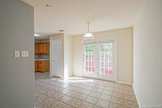 a view of an empty room with a window