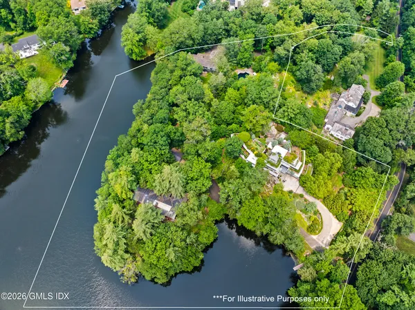 an aerial view of a house with a yard and garden