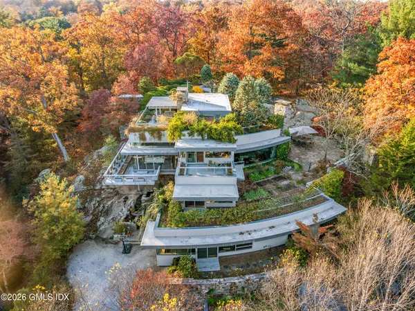 aerial view of a house with a yard