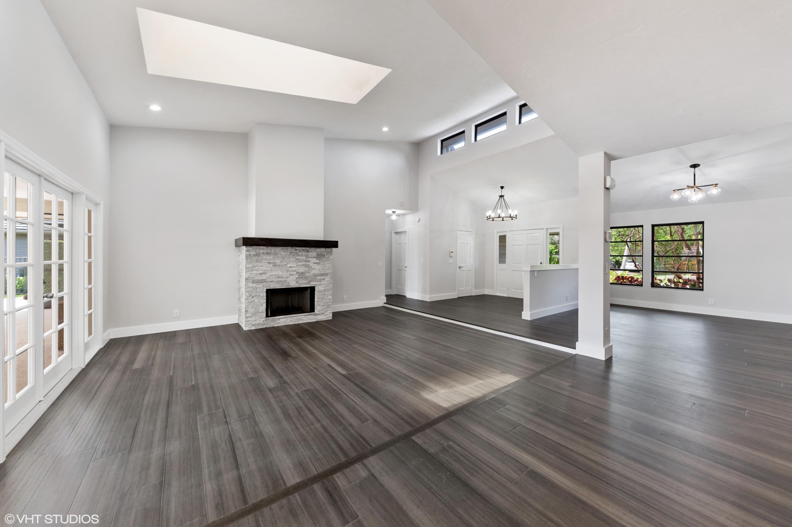 58 Dunbar Road Palm Beach Gardens, FL 33418 - Photo 4 of 36 Family room wood fireplace