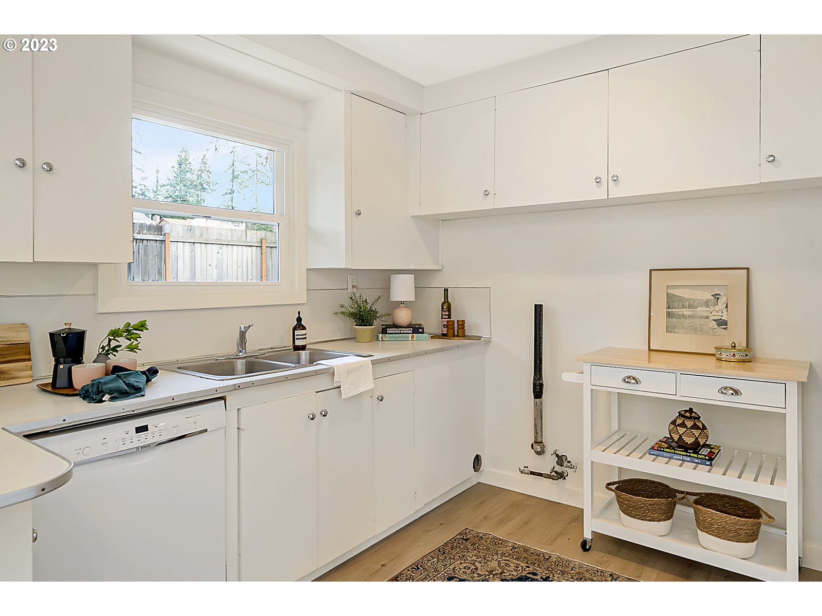 8900 Southwest 69th Avenue Portland, OR 97223 - Photo 13 of 31 a kitchen with a sink cabinets and window