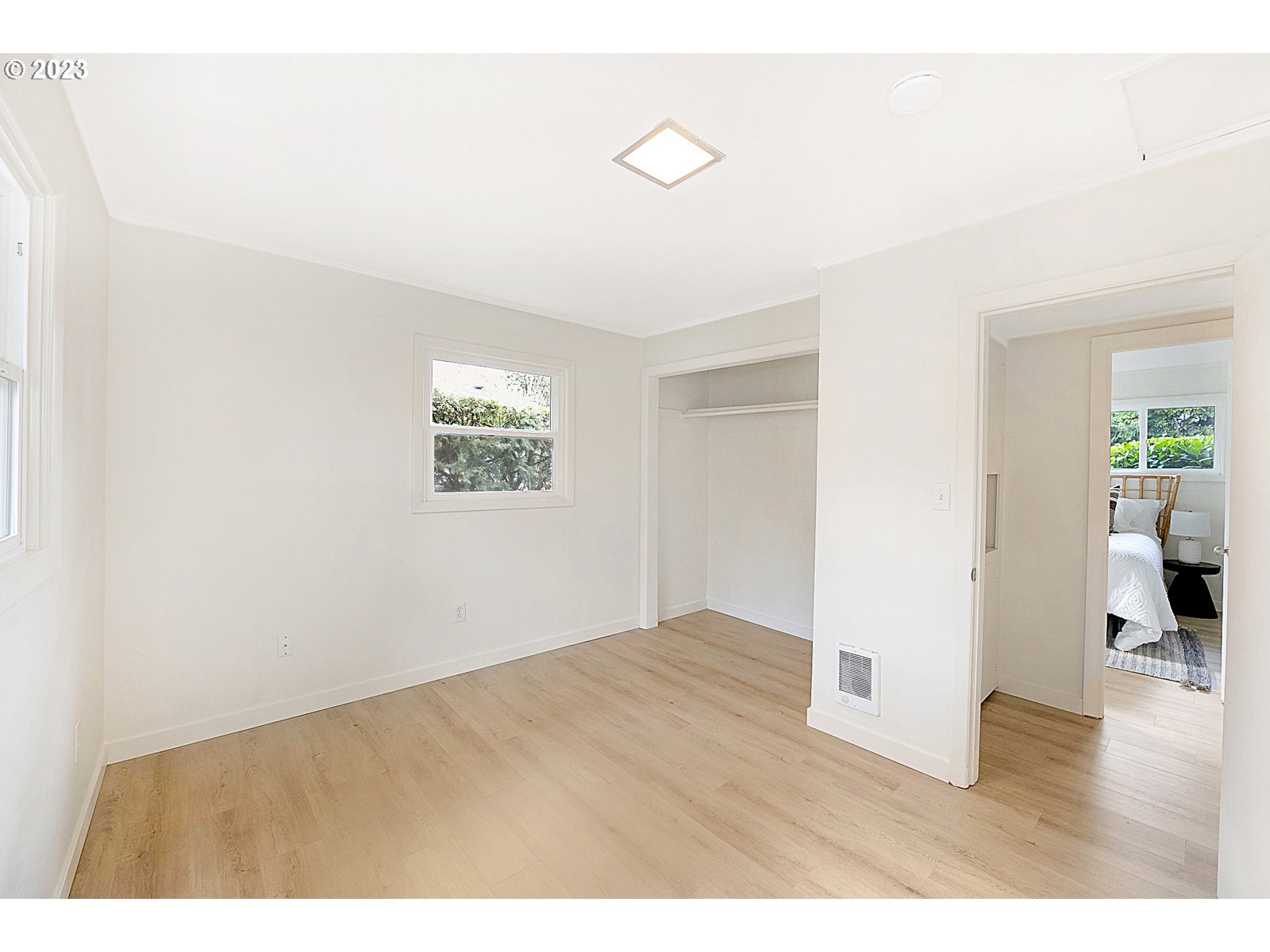 8900 Southwest 69th Avenue Portland, OR 97223 - Photo 21 of 31 a view of an empty room with wooden floor