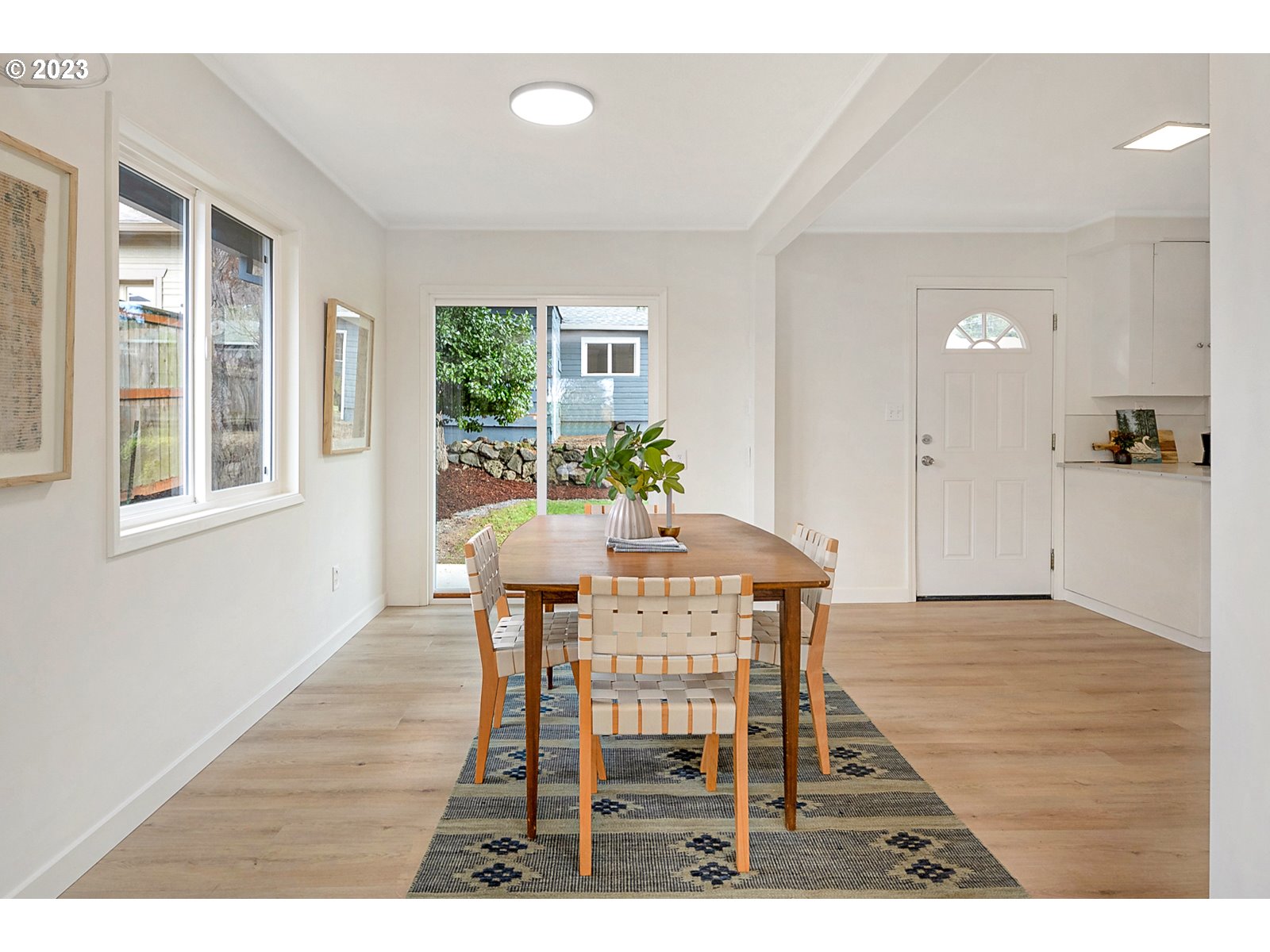 8900 Southwest 69th Avenue Portland, OR 97223 - Photo 9 of 31 a view of a dining room with furniture and wooden floor