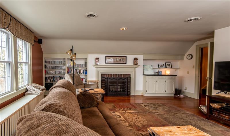 1265 Highland Road Sharon, PA 16146 - Photo 14 of 25 This wonderful family room has fireplace and great shelves and built-ins for storage.