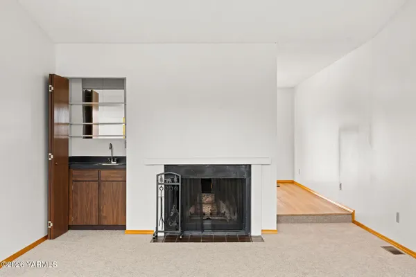 a kitchen with granite countertop cabinets stainless steel appliances and a sink