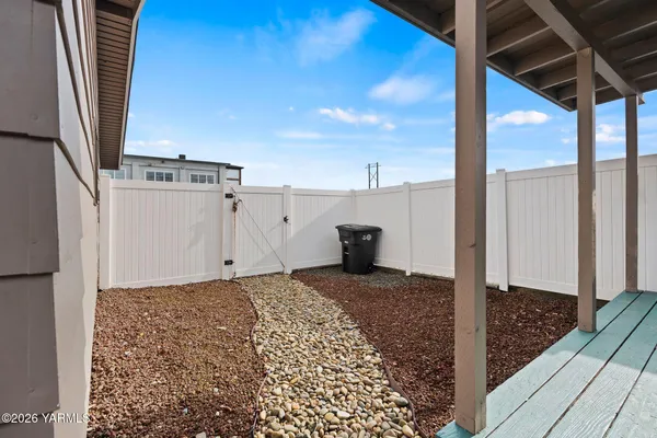 a view of garage and yard