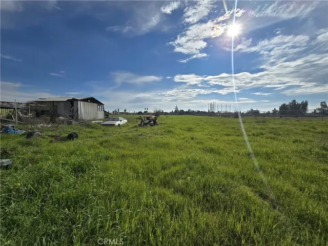 view of an house with backyard and outdoor seating
