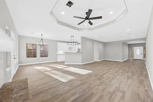 a view of a kitchen with a sink and a refrigerator