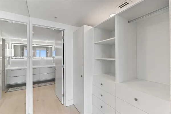 a view of an empty walk in closet