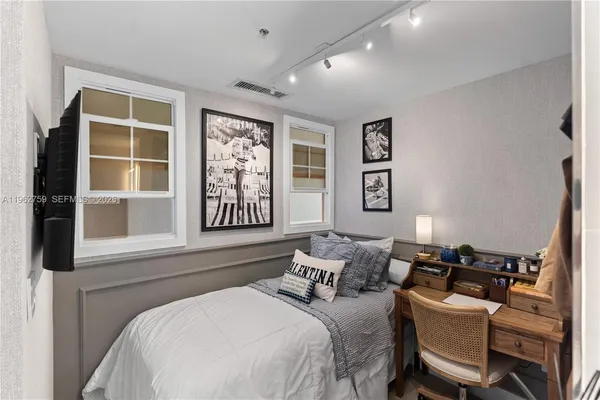 a bed room with a bed and a window