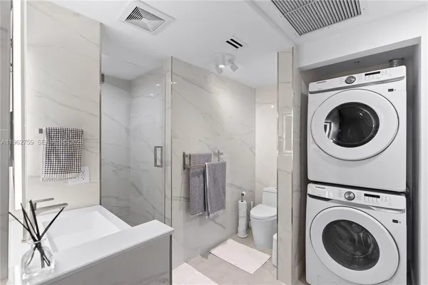 a spacious bathroom with a bathtub and a shower