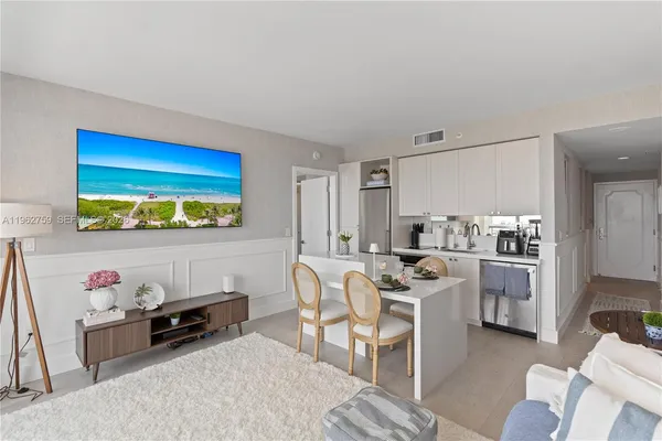 a view of a workspace with furniture and a kitchen