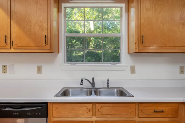 a kitchen with a sink and cabinets