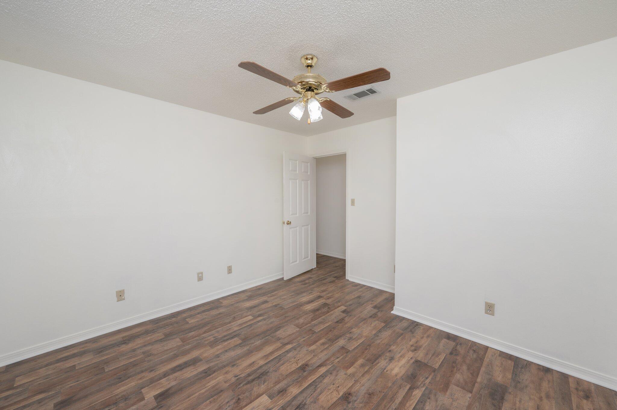 624 Hill Street DeFuniak Springs, FL 32435 - Photo 17 of 34 wooden floor in an empty room