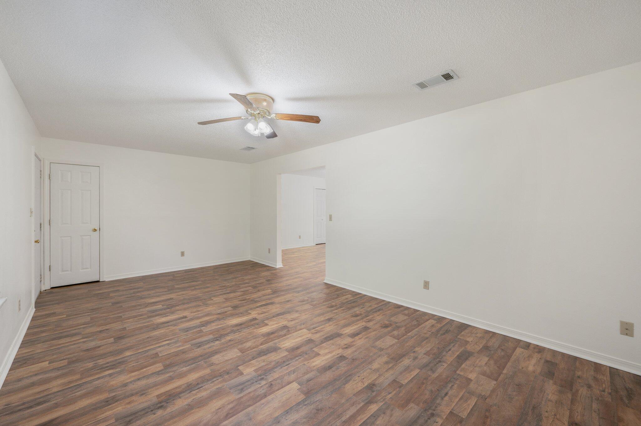 624 Hill Street DeFuniak Springs, FL 32435 - Photo 9 of 34 wooden floor in an empty room