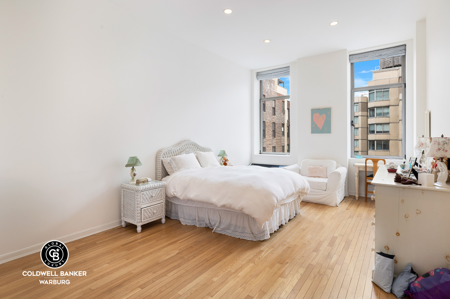 252 7th Avenue, Unit 12I Manhattan, NY 10001 - Photo 9 of 15 a bedroom with a bed and a window