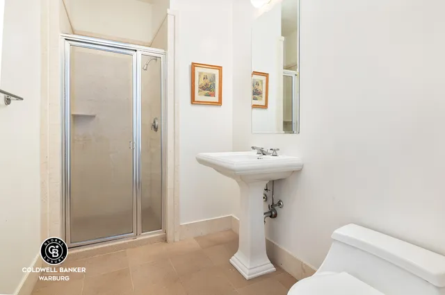 a bathroom with a sink double vanity and a mirror