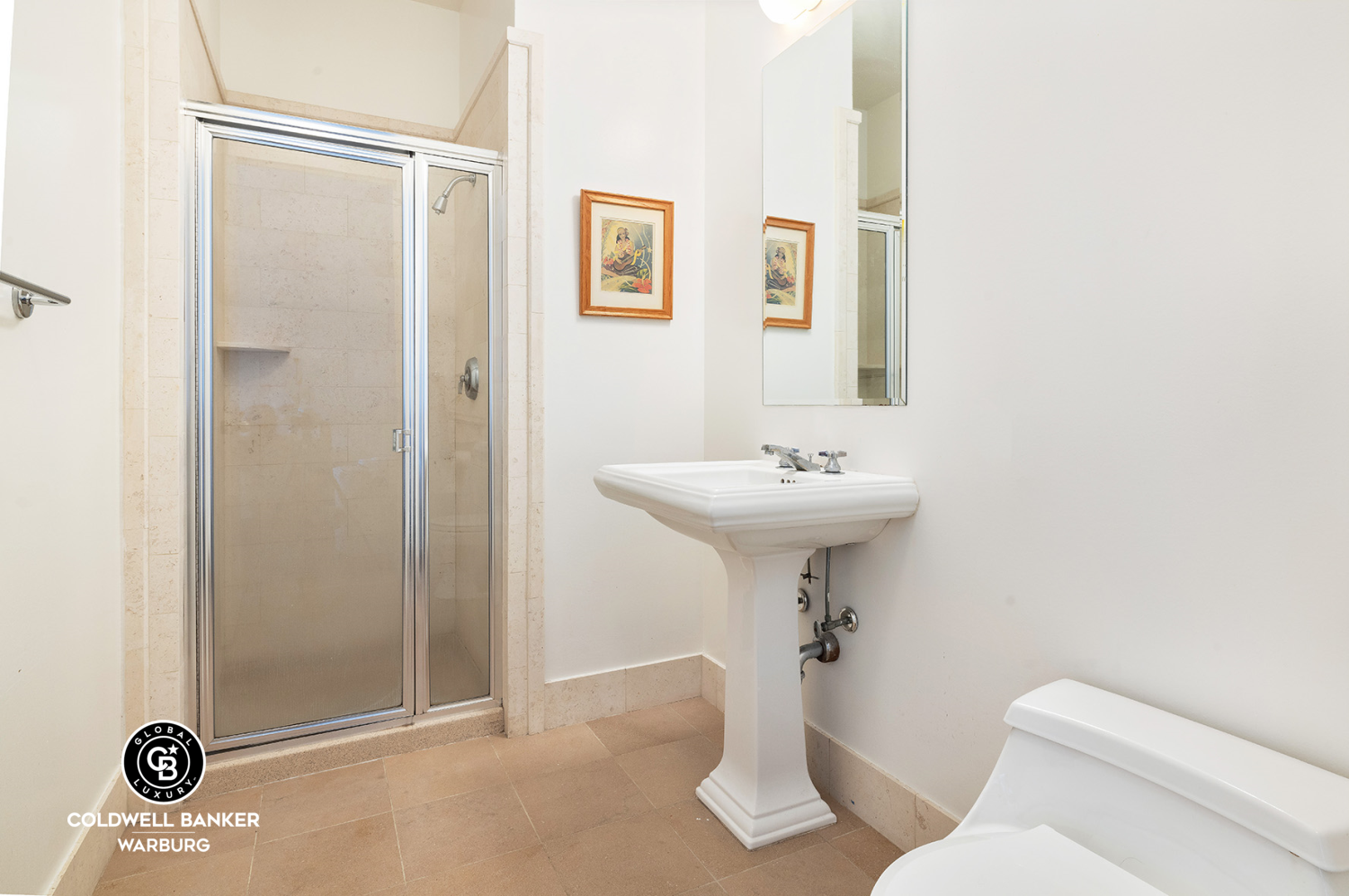 252 7th Avenue, Unit 12I Manhattan, NY 10001 - Photo 11 of 15 a bathroom with a sink a toilet a mirror and shower