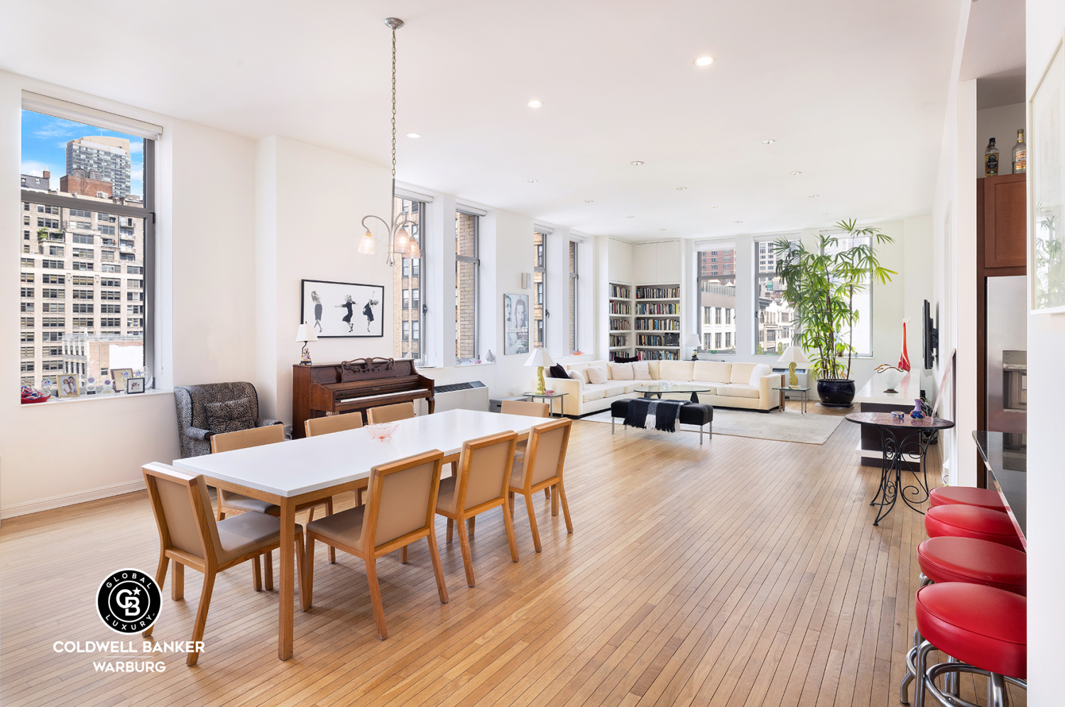 252 7th Avenue, Unit 12I Manhattan, NY 10001 - Photo 3 of 15 a view of a dining room with furniture window and wooden floor