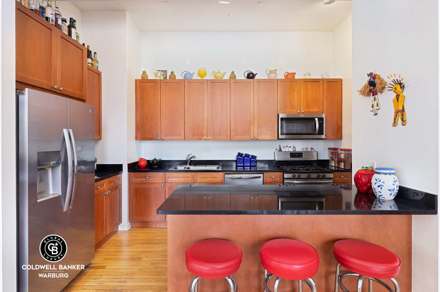 252 7th Avenue, Unit 12I Manhattan, NY 10001 - Photo 4 of 15 a kitchen with stainless steel appliances granite countertop a refrigerator and a stove top oven