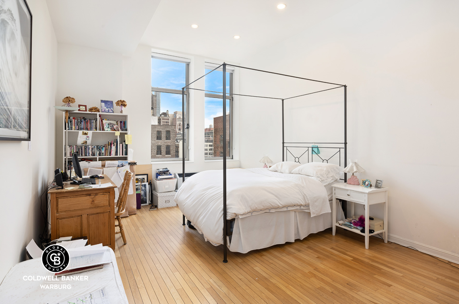 252 7th Avenue, Unit 12I Manhattan, NY 10001 - Photo 8 of 15 a bedroom with a bed and a chair