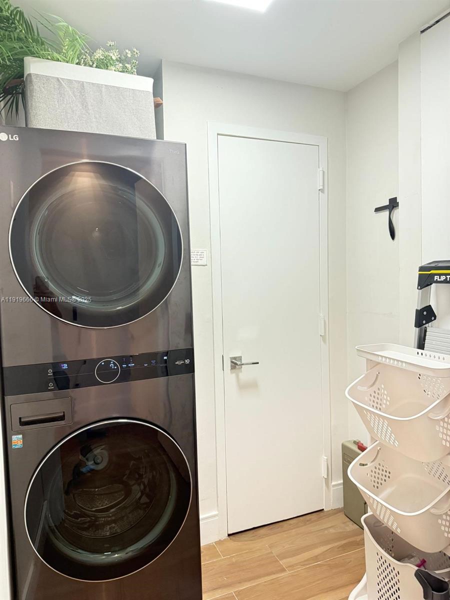 711 Crandon Boulevard, Unit 401 Key Biscayne, FL 33149 - Photo 17 of 29 a utility room with dryer and washer