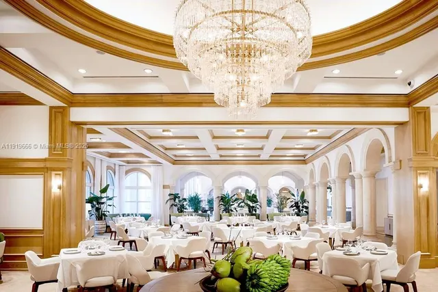 a view of a table and chairs in backyard