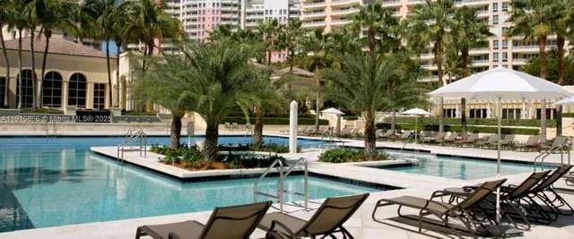 a view of a swimming pool with a patio